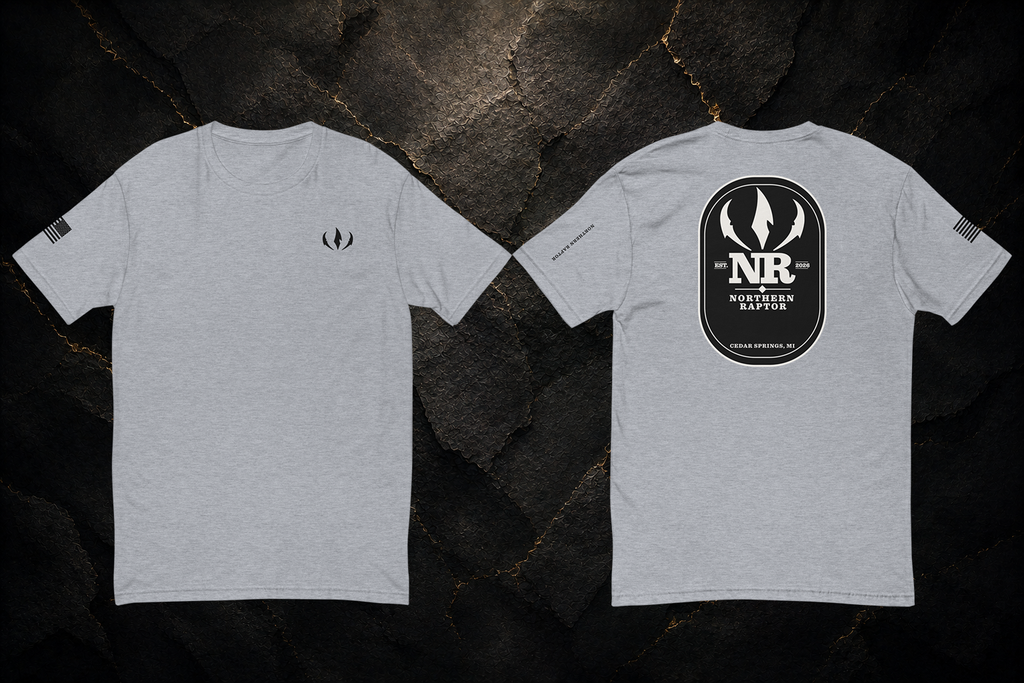 Northern Raptor Heritage T-Shirt in heather grey with front crest and Heritage back graphic on dark background