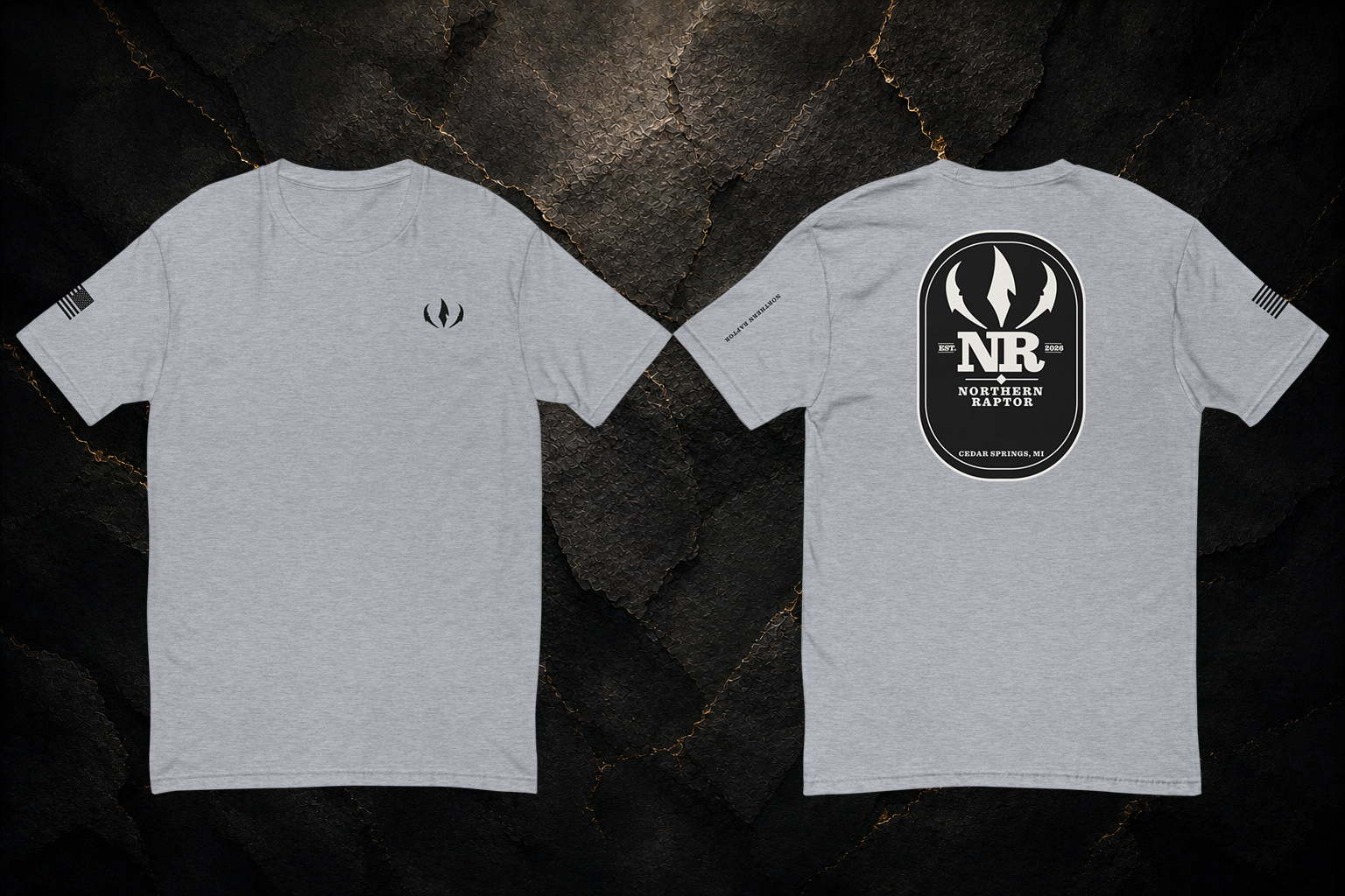 Northern Raptor Heritage T-Shirt in heather grey with front crest and Heritage back graphic on dark background